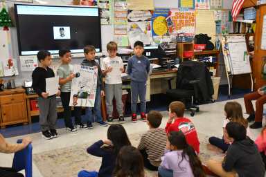 Second graders presented their speeches to other classes.