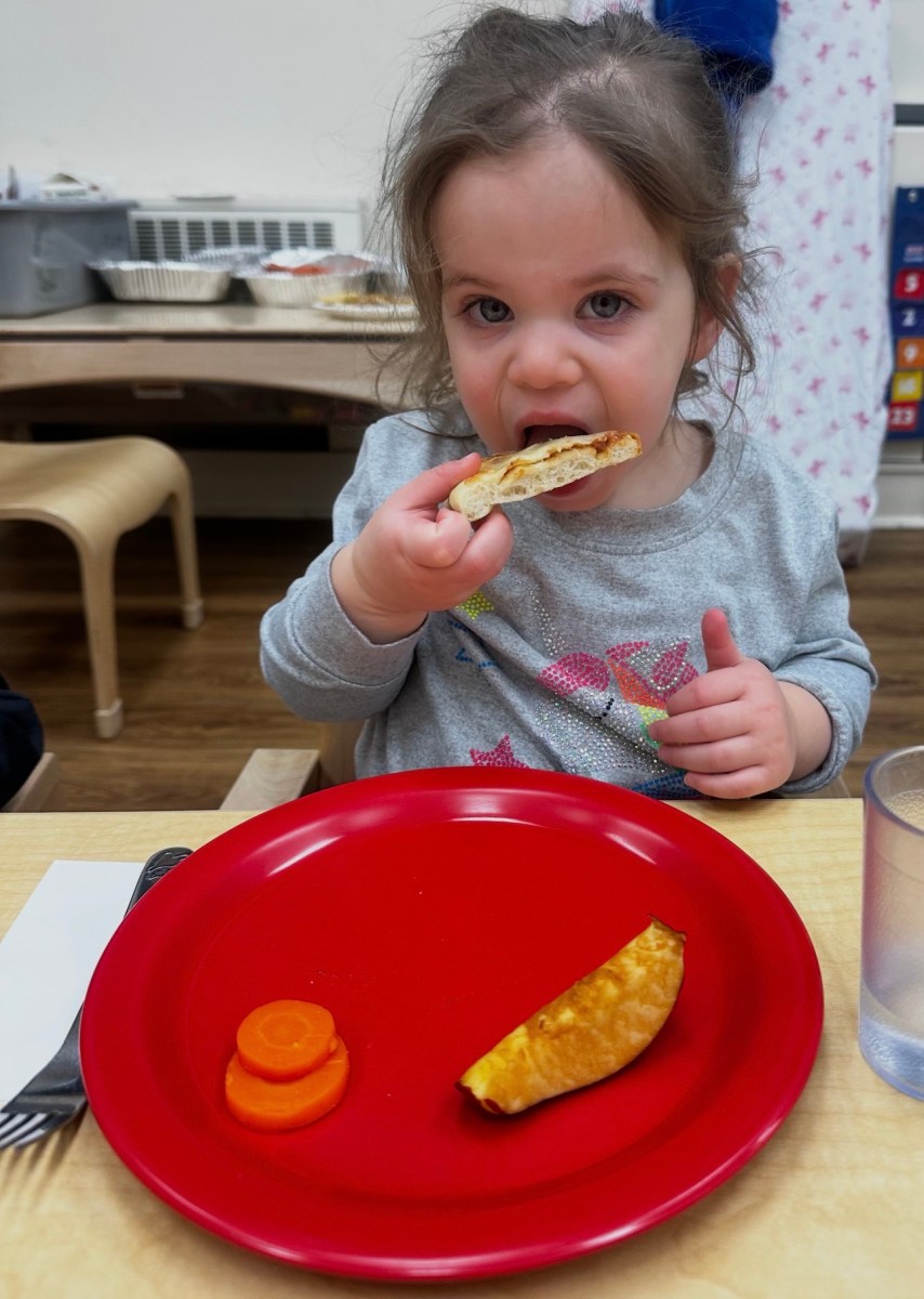 Port Washington Children's Center students celebrated community with a pizza party.