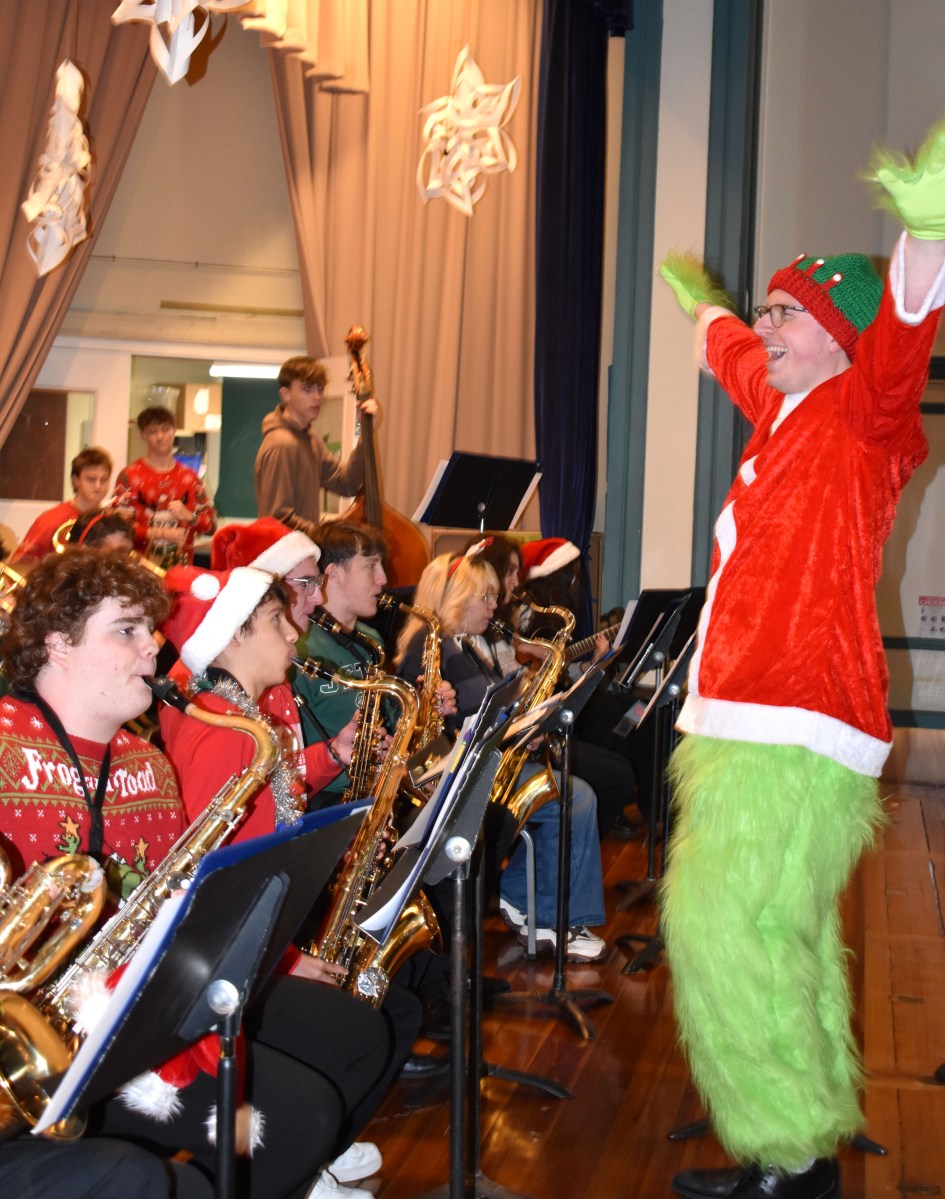 North Shore High School Music Teacher Brandon Bromsey with the high school orchestra.