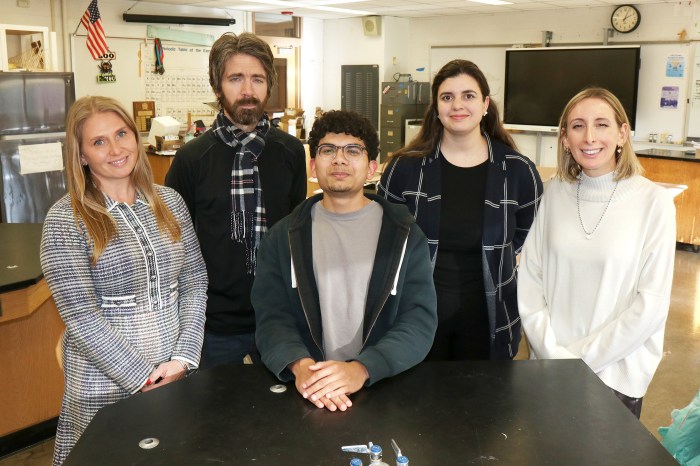 Arnav Pemmaraju from William A. Shine Great Neck South High School with educators.