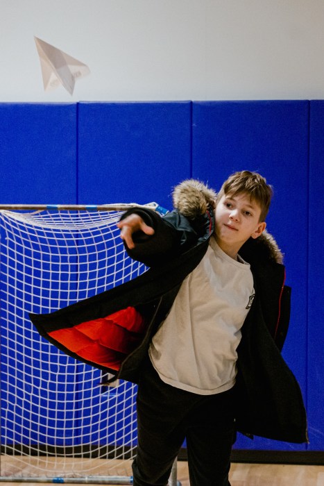 Students explored an aerodynamics station where they designed and tested paper airplanes