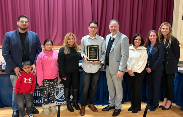 Manhasset Board of Education presents Dr. William A. Shine Student Award to Matthew Cruz (center)