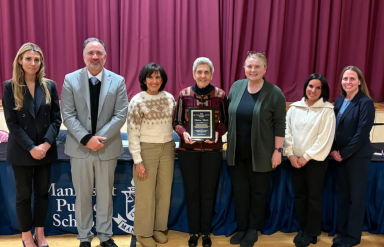 Manhasset Board of Education presents Dr. William A. Shine Humanitarian Award to Patricia Master (center)