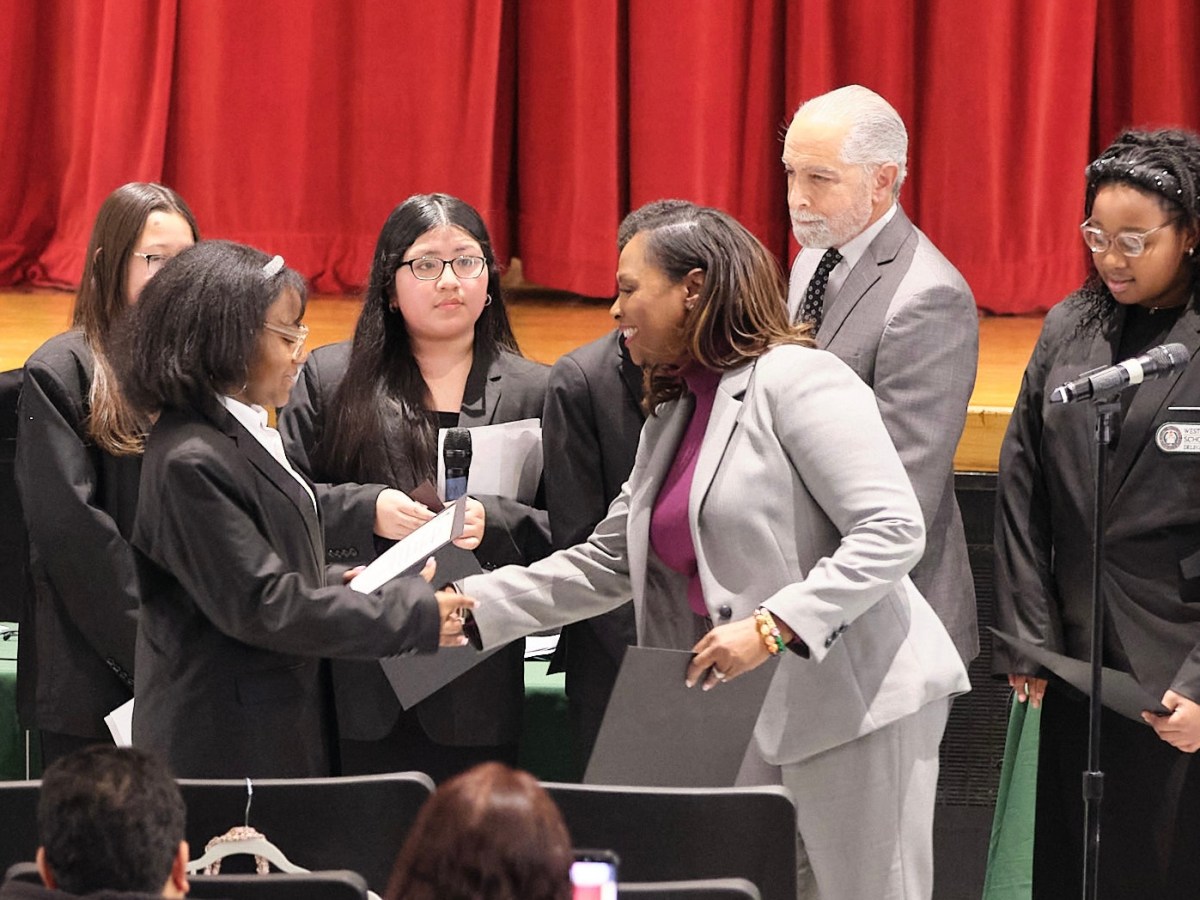 Superintendent of Westbury Schools, Dr. Tahira DuPree Chase, and Westbury Board of Education President Robert Troiano Jr. presented middle school students in the Scholars of Government program with certificates at the board’s meeting on Tuesday.