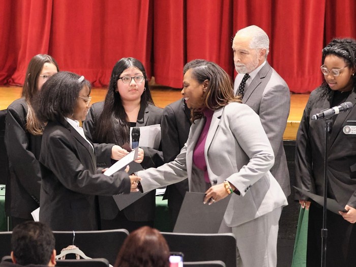 Superintendent of Westbury Schools, Dr. Tahira DuPree Chase, and Westbury Board of Education President Robert Troiano Jr. presented middle school students in the Scholars of Government program with certificates at the board’s meeting on Tuesday.