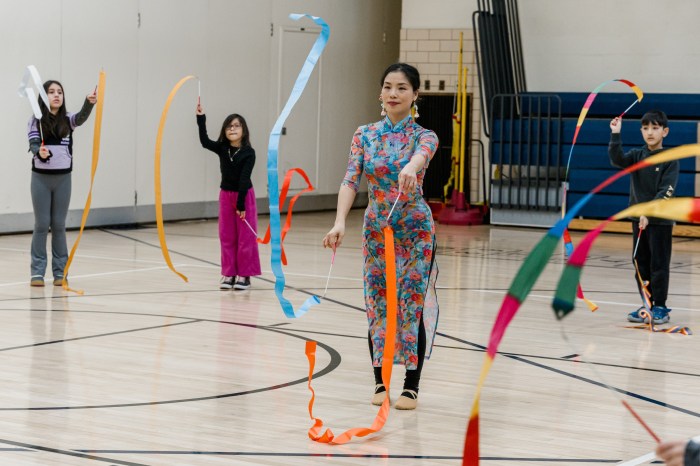 During a small group session students learned the traditional ribbon dance.