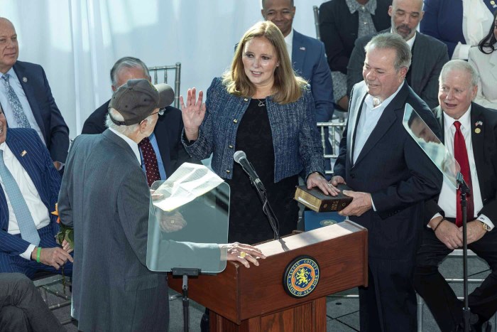 Nassau County Legislator Minority Leader Delia DeRiggi-Whitton being sworn in.