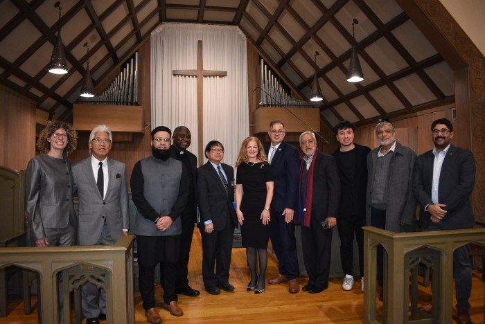 Community Church of East Williston Pastor Ed Palafox (C.) celebrated the centennial with East Williston officials, including Mayor Bonnie Parente (C.).
