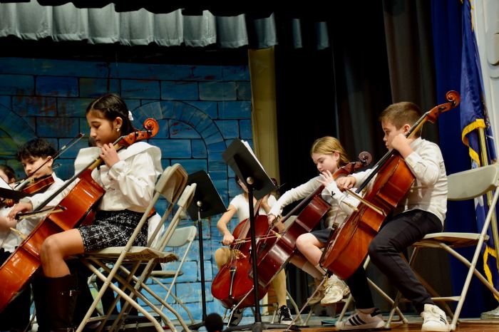 Orchestra students shared musical skills with the school board meeting.