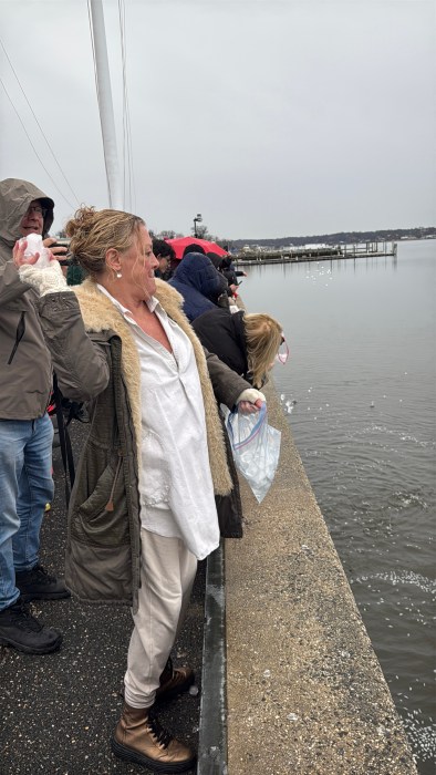 Protestors throwing ice off the dock. 