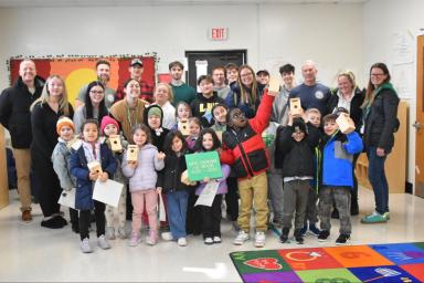 Community pride shines as Kate DeRuvo’s class joins technology students, Woodward Parkway principal Patrick Klocek and Farmingdale Board of Education Members George Andriopoulos and Kathy Lively.