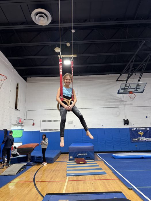 A young girl during the gymnastics clinic. 