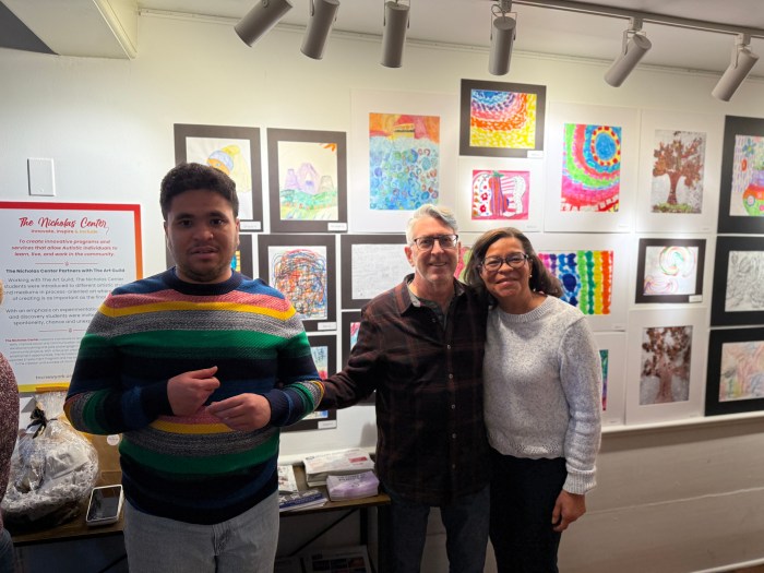 Ben (L.) and his family walked around The Nicholas Center during the art show.