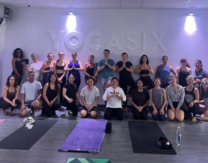 Yoga students after class at YogaSix Manhasset