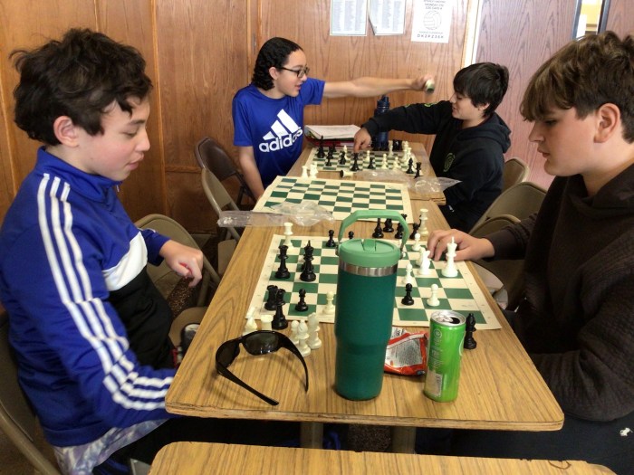 Hicksville Middle School student playing chess during their lunch period.
