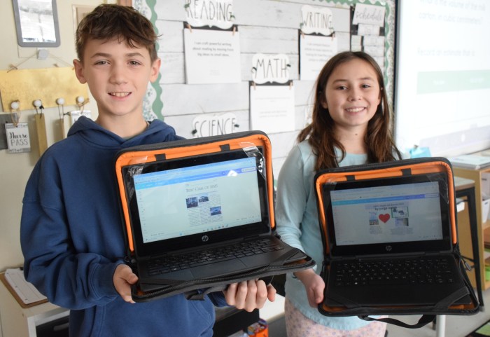 Fifth graders Jimmy Shehada and Paige Walsh used Canva to design a newspaper pagefor their feature stories.