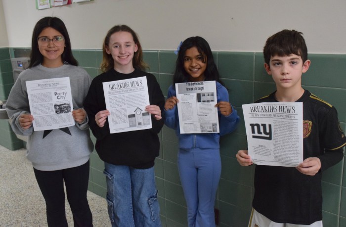 Fifth graders, Francesca Guigno, Emma Palumbo, Bella Ramoutar and Dominic Egan (L. to R.) showcased their news reports as part of a journalism unit.