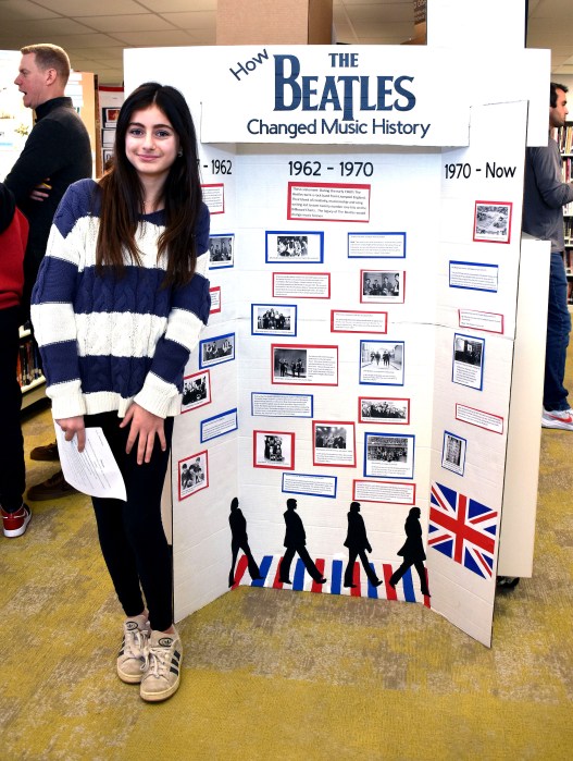 A North Shore student with her project on The Beatles. 