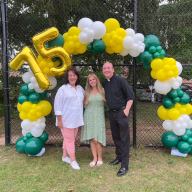 Assistant principal, Barbara Graham, principal Josephine Guidice, and Fr. Michael Bissex, Pastor (L. to R.) at a 75th anniversary barbecue.