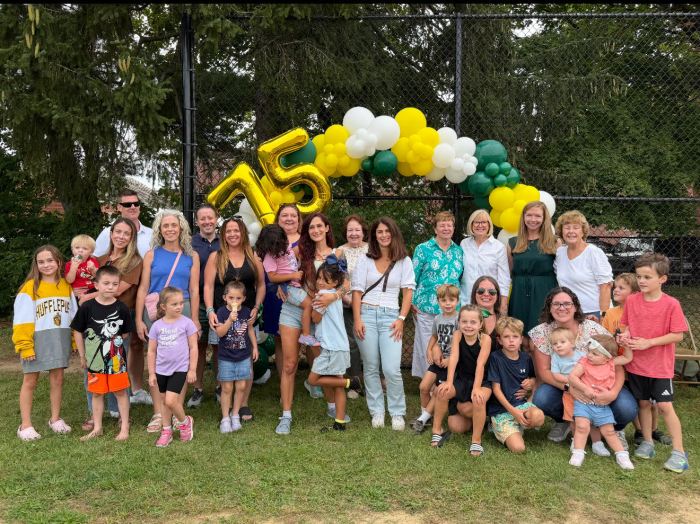 St. Aidan's community members at a 75th anniversary barbecue celebration.