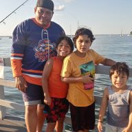 Tomas Orellana (L.) with some of his children at Steppingstone Park in Great Neck