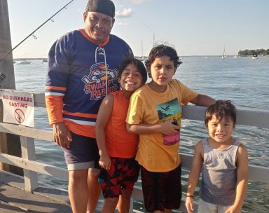 Tomas Orellana (L.) with some of his children at Steppingstone Park in Great Neck