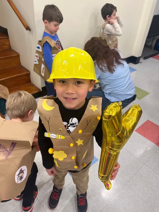 Students paraded as letters from the alphabet.