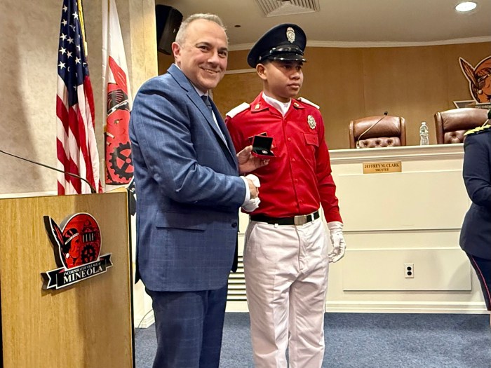 Mayor Paul Pereira with a junior firefighter visiting from Panama.