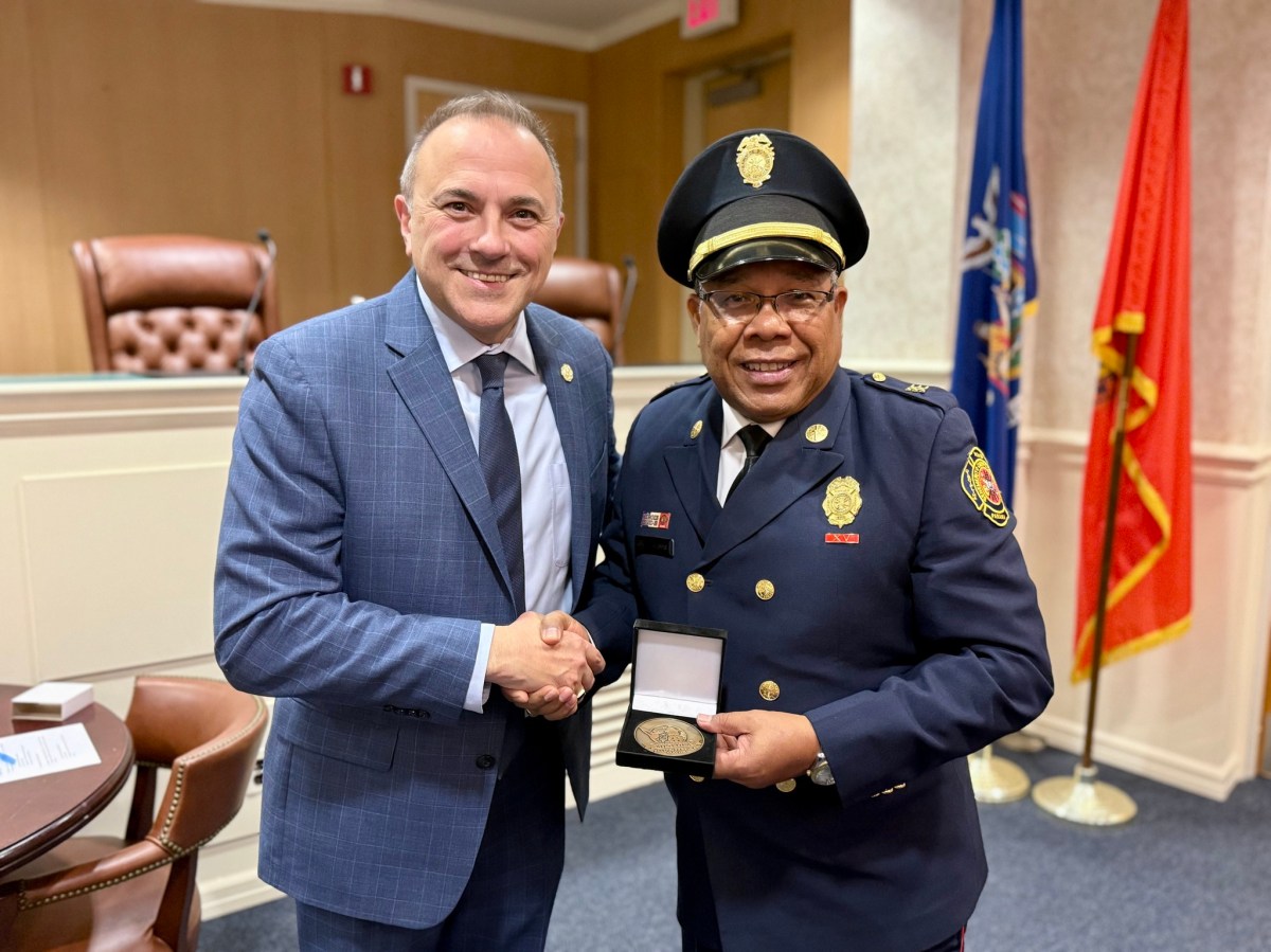 Mayor Paul Pereira (L.) with a firefighting official from Panama.