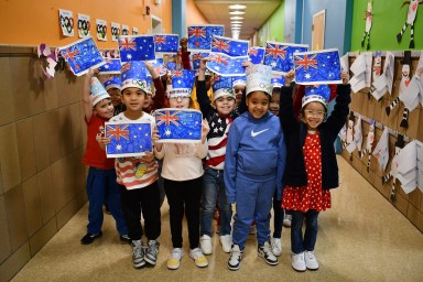 Students celebrated the winter Olympics with a flag parade.