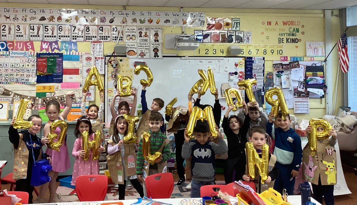 Meadow Drive kindergartners show off their creative letter costumes as they prepare for their celebratory alphabet parade.