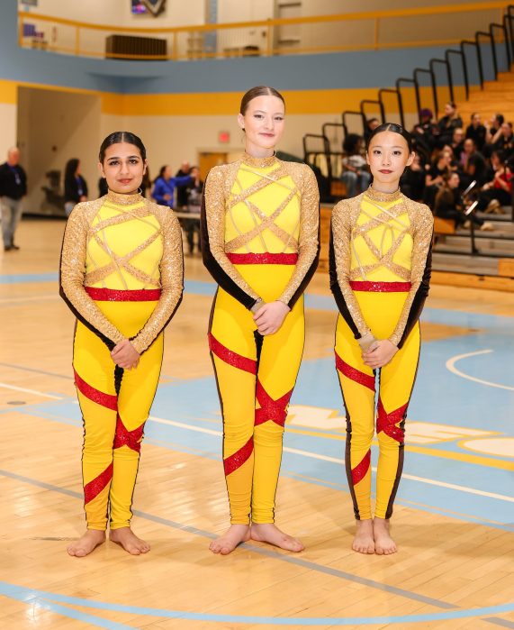The Roslyn Colorguard captains (from L. to R.) Ariya Shulka, Alexa Steinvurzel, and Chloe Cheng.
