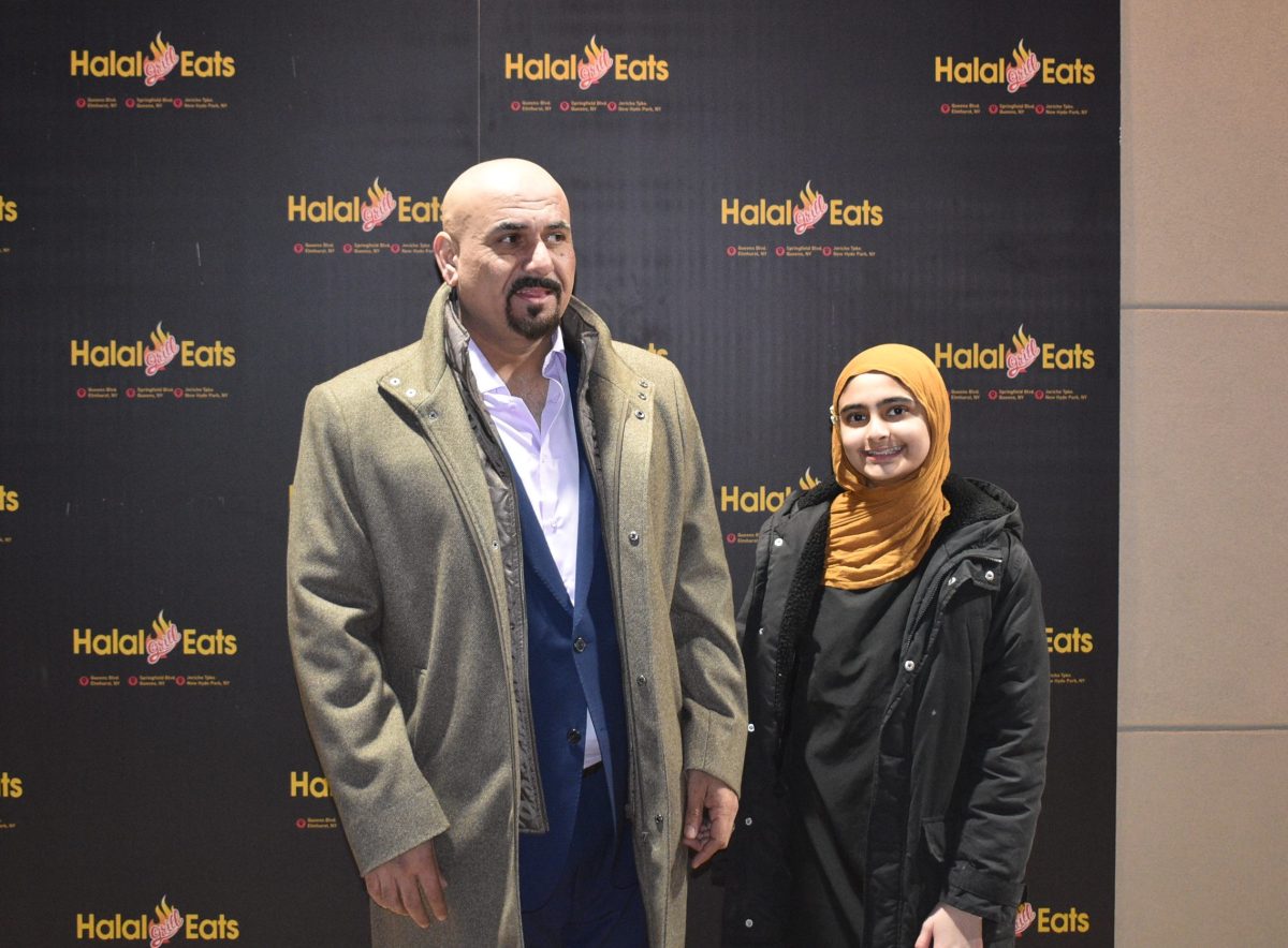 Jimmy Amad, (L.) with his daughter at the grand opening celebration for Halal Grill Eats.