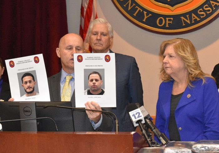 Commissioner of Police Patrick Ryder shows photos of the arrested men alongside County Executive Bruce Blakeman and District Attorney Anne Donnelly, (L. to R.).