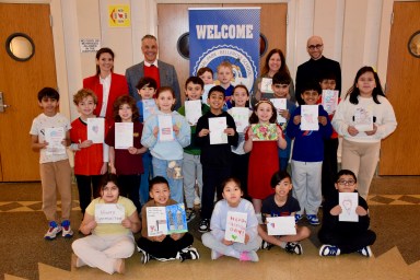 Floral Park-Bellerose School third graders in Amanda Norton’s class are pictured with Councilman Thomas E. Muscarella (Center L.) principal Lauren Quezada (L.) and assistant principal Michael Elka (R.).