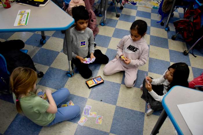 Students collaborate in play activities.