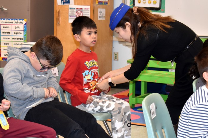 Students buckled up for their virtual flight to China.