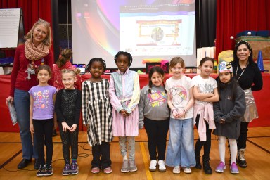 Eight learners from Mineola’s Hampton Street School were recently recognized for participating in the Stony Brook University Institute for Advanced Computational Science Challenge. (L-R): STEAM teacher Lisa Richards, learners Evelyn Bond, Faith Phelps, Ozioma Asuzu, Amarachi Asuzu, Leah Goncalves, Margaret Gillespie, Gianna Natale and Samantha Hincapie and Hampton Street principal Amaris Melendez.