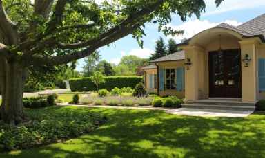 Hicks Landscapes won the gold award in the “Residential Entrance” category for designing this front yard with plantings, walkways, and an enhanced driveway.