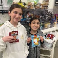 The daughters of Adam and Jennifer Aziz at a Fountain of Kindness event