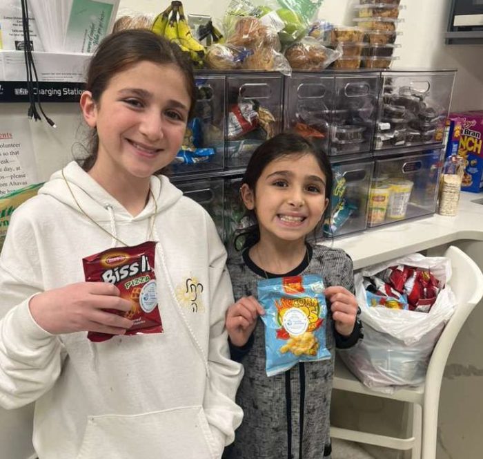 The daughters of Adam and Jennifer Aziz at a Fountain of Kindness event
