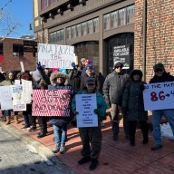 Dozens protest in front of U.S. Rep. Tom Suozzi's office in Glen Cove after he was one of seven Democrats to vote in favor of a House of Representatives appropriation bill providing billions of dollars to ICE.