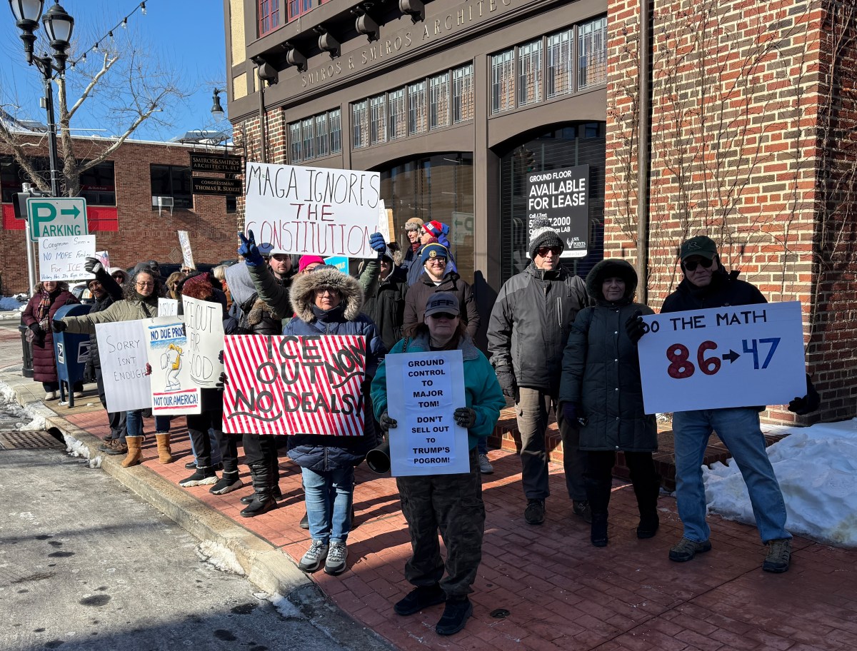 Dozens protest in front of U.S. Rep. Tom Suozzi's office in Glen Cove after he was one of seven Democrats to vote in favor of a House of Representatives appropriation bill providing billions of dollars to ICE.