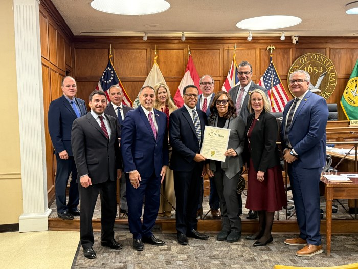 Oyster Bay Town Supervisor Joseph Saladino (4th from L.) and the town board honored Robert Brown (C.) and Carol Brown (4th from L.) for their service to the community during Black History Month.