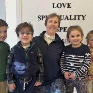 Principal Sister Kelly Quinn (C.) with some students at Our Lady of Grace