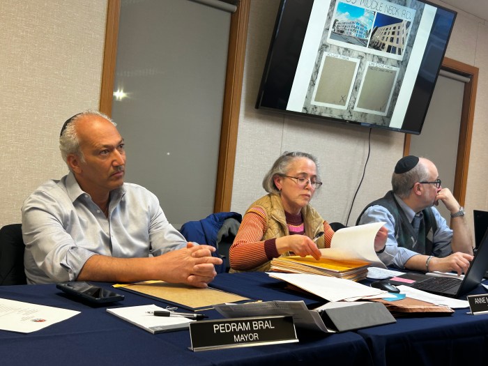 Mayor Pedram Bral, Trustee Anne Mendelson, and Deputy Mayor Barton Sobel (L. to R.) listen to facade material petition