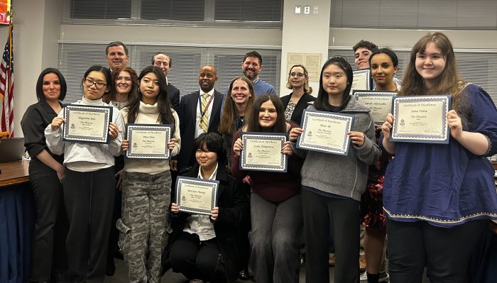The Phoenix club members with the Manhasset Board of Education