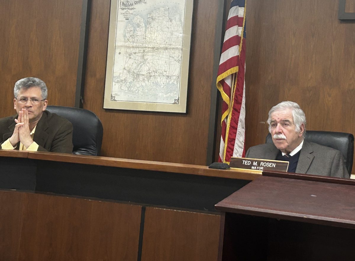 Mayor Ted Rosen and Deputy Mayor Lawrence Katz (R. to L.) listening to Yonathan Jacobi's petition for a conditional use permit