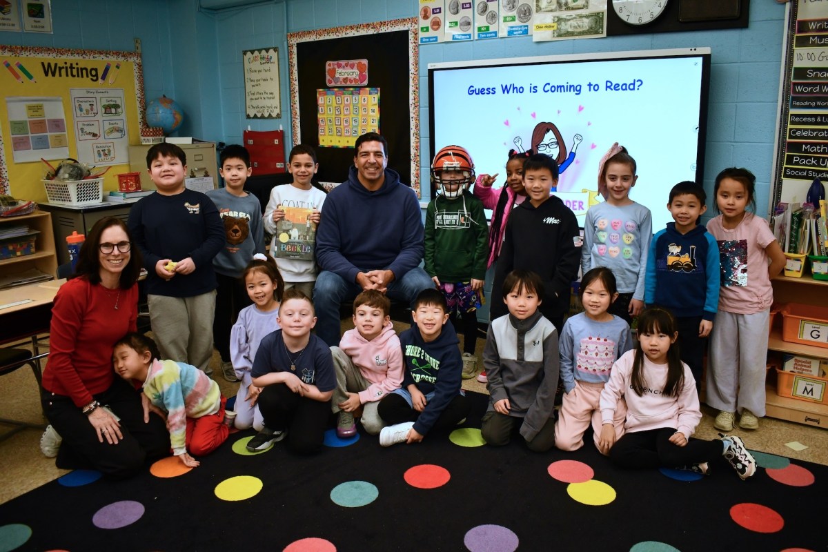 Former NFL player J.P. Foschi was a mystery guest reader for second graders at Shelter Rock Elementary School