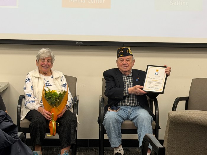 Karin and Harry Arlin were given flowers and a certificate for sharing their story as Holocaust survivors at Sid Jacobson JCC.